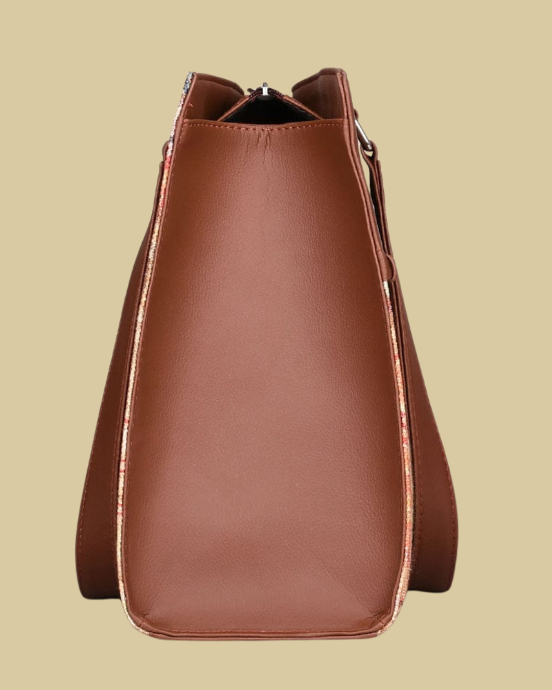 Brown leather handbag on a beige background