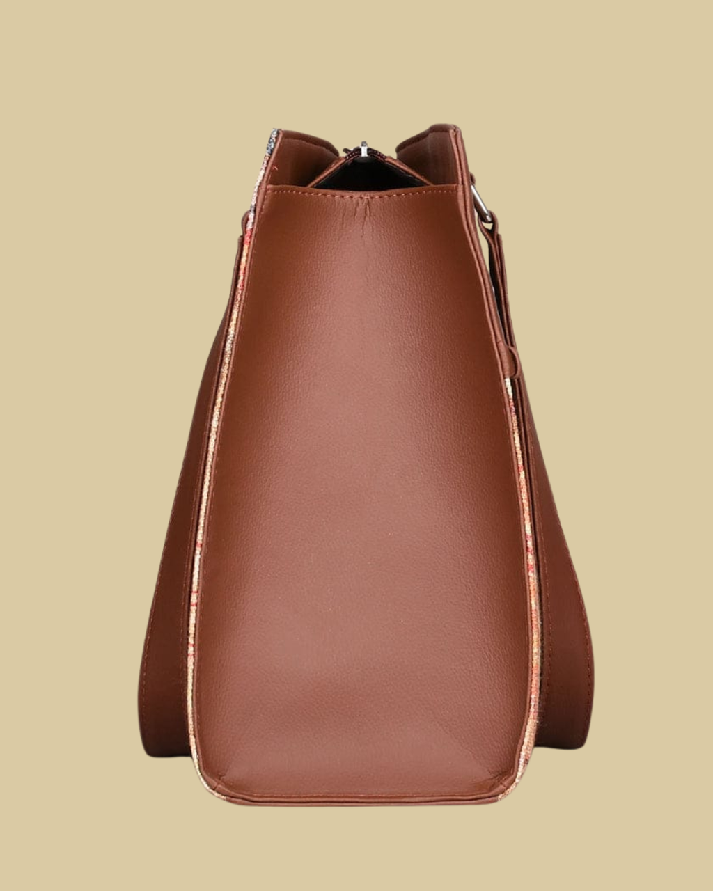 Brown leather bucket bag on a beige background