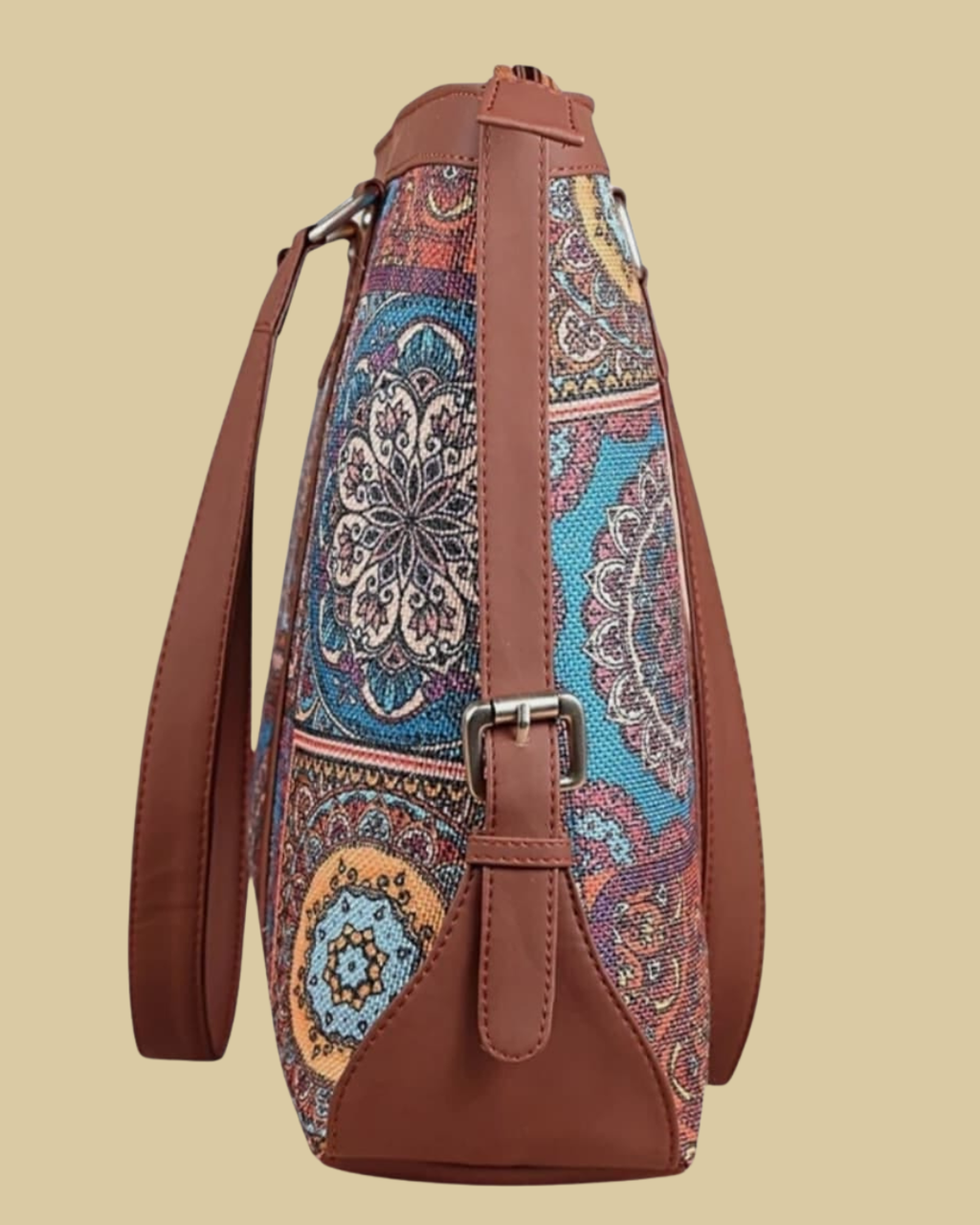 Brown bag with colorful paisley pattern on a beige background