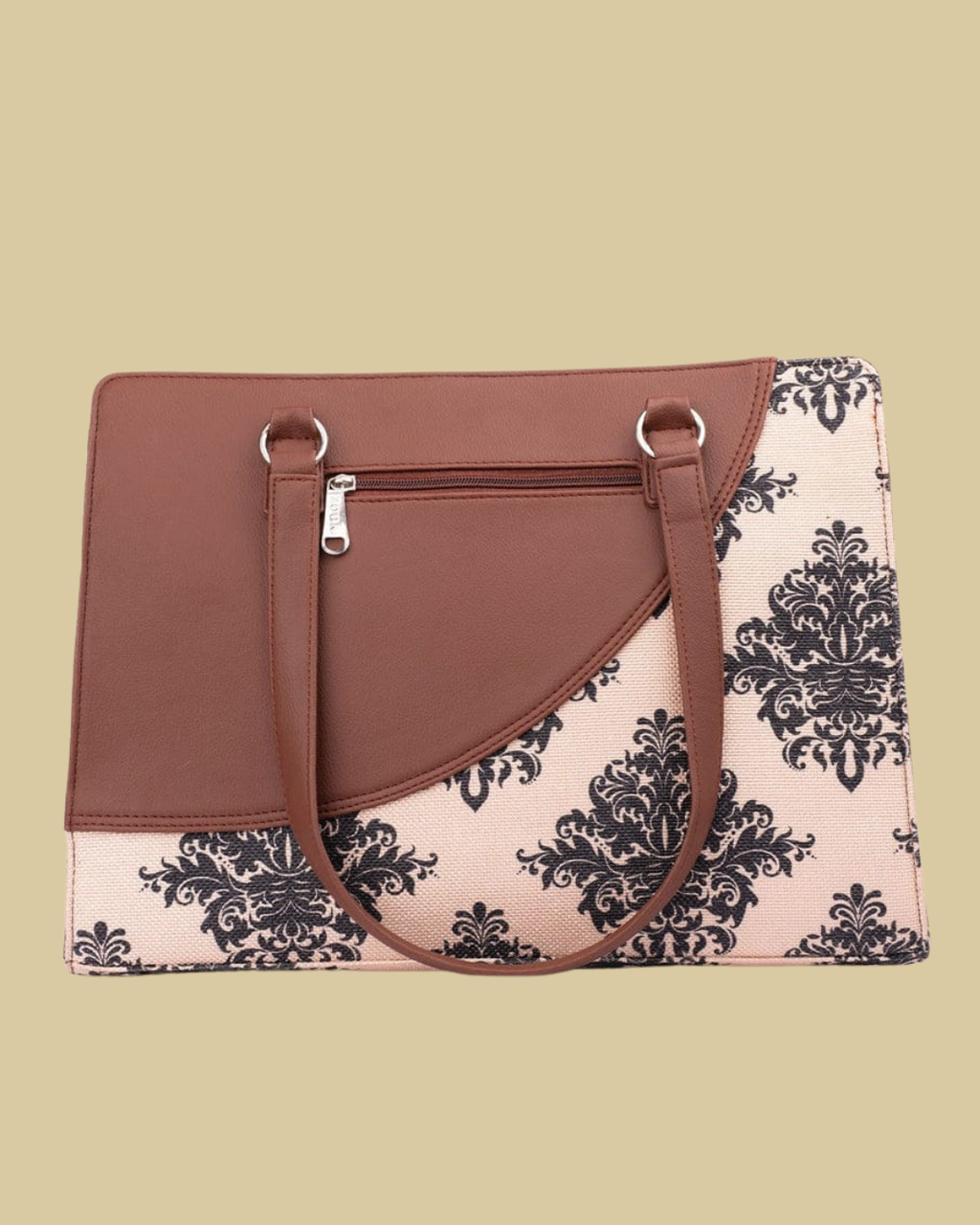 Handbag with brown leather top and black floral pattern on beige background