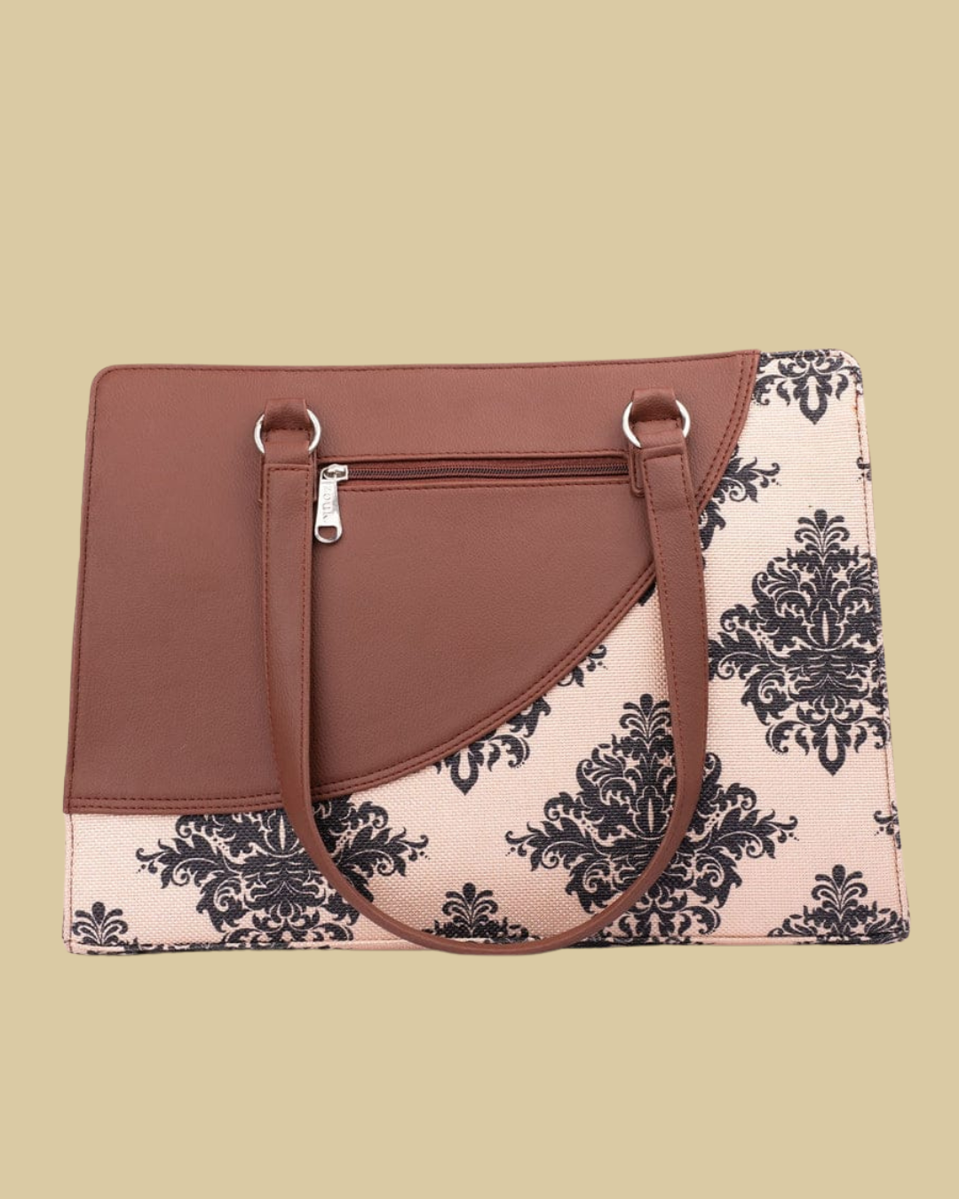 Handbag with brown leather top and black floral pattern on beige background