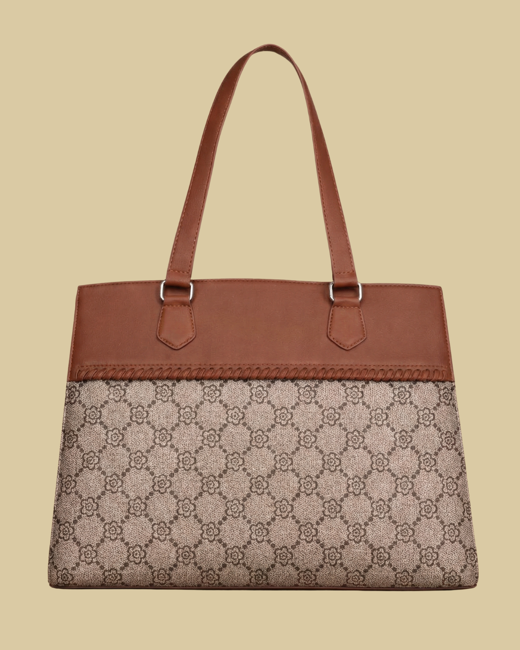 Brown handbag with patterned flap on a beige background