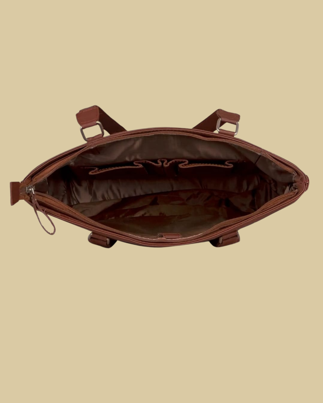 Brown leather bag on a beige background