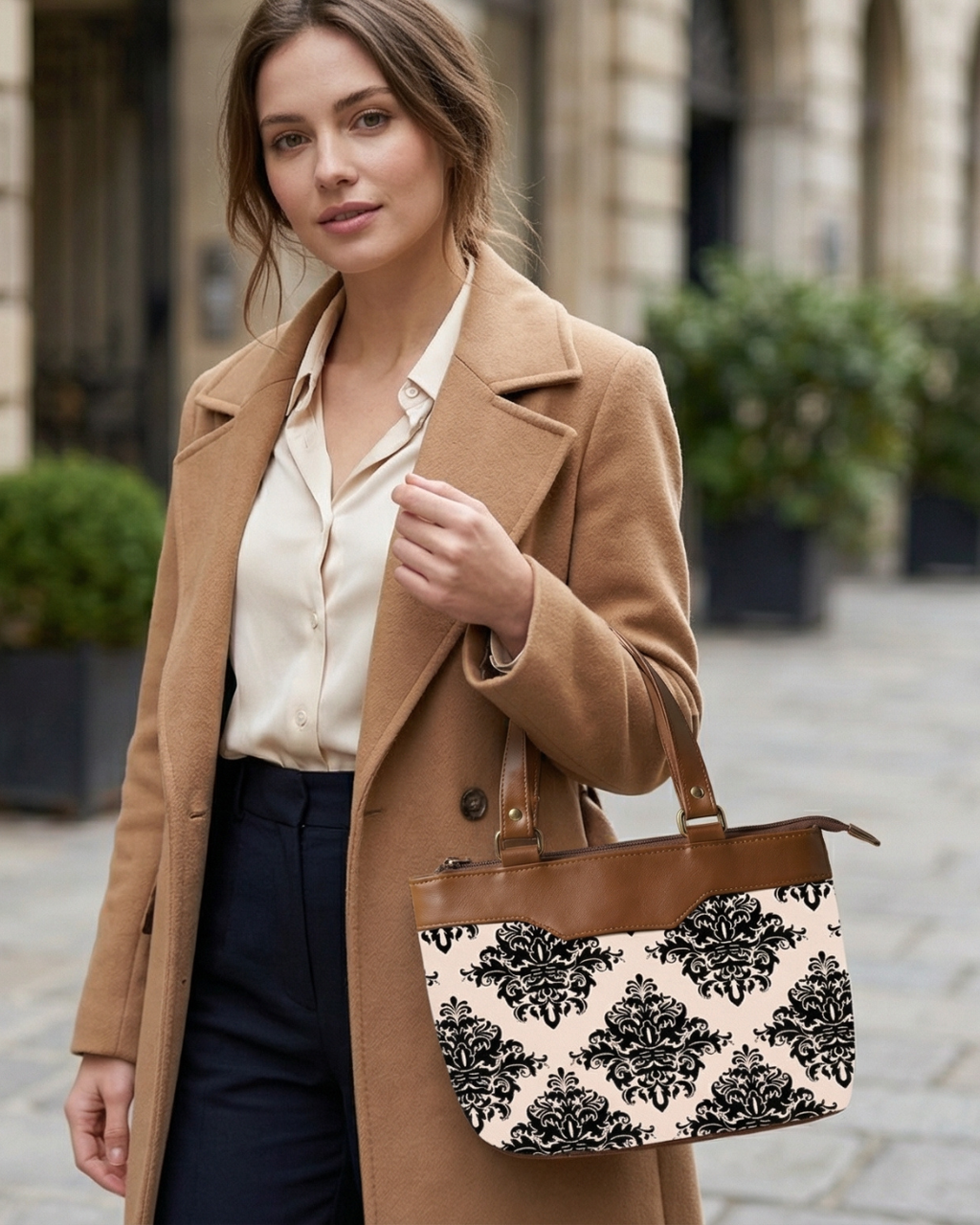 Woman holding a patterned handbag in an urban setting