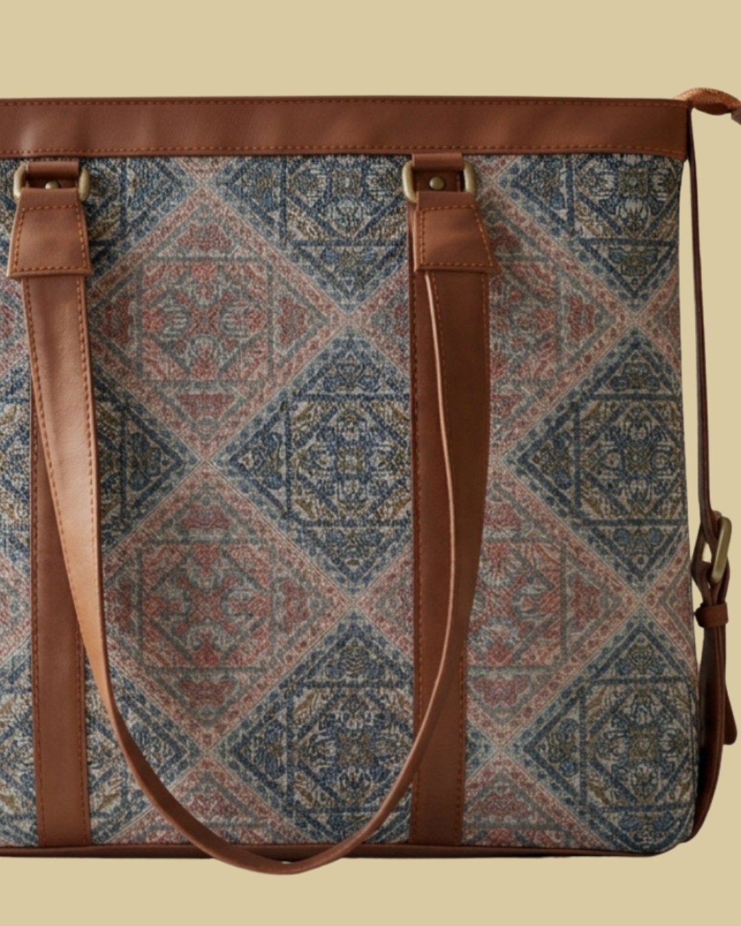Patterned bag with brown straps on a beige background
