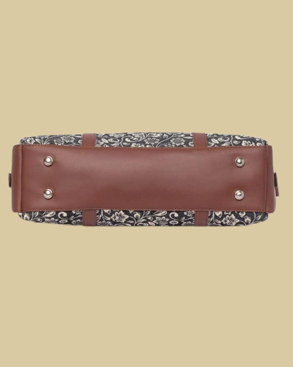 Brown suitcase with floral patterned top and bottom on a beige background