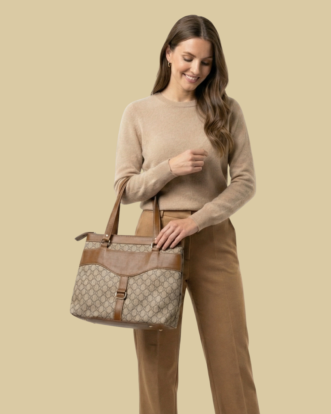 Woman holding a patterned handbag against a beige background