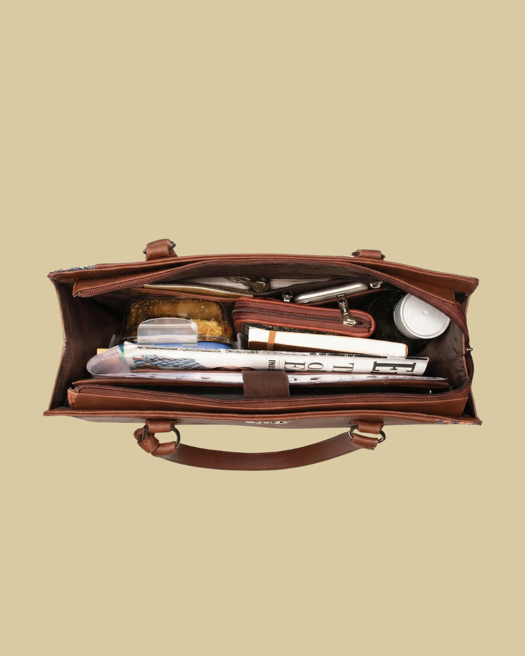 Brown leather briefcase with compartments on a beige background