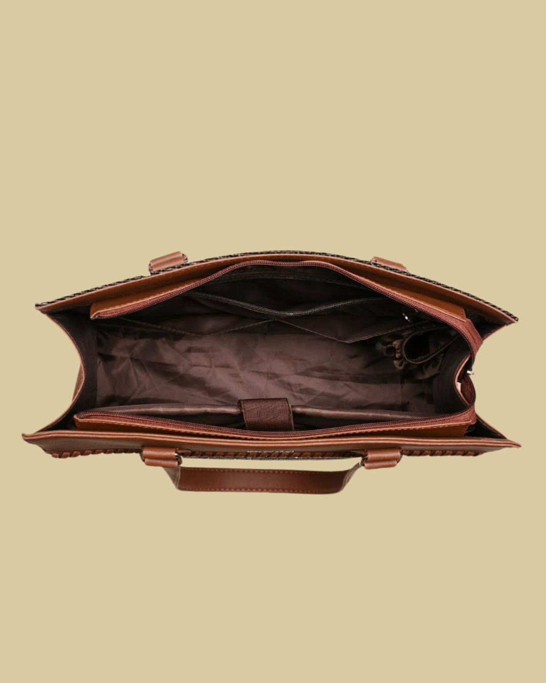 Brown leather bag on a beige background