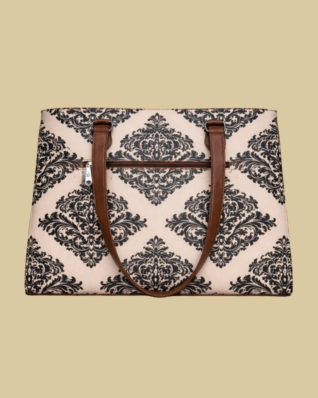 Bag with black floral pattern and brown handles on a beige background