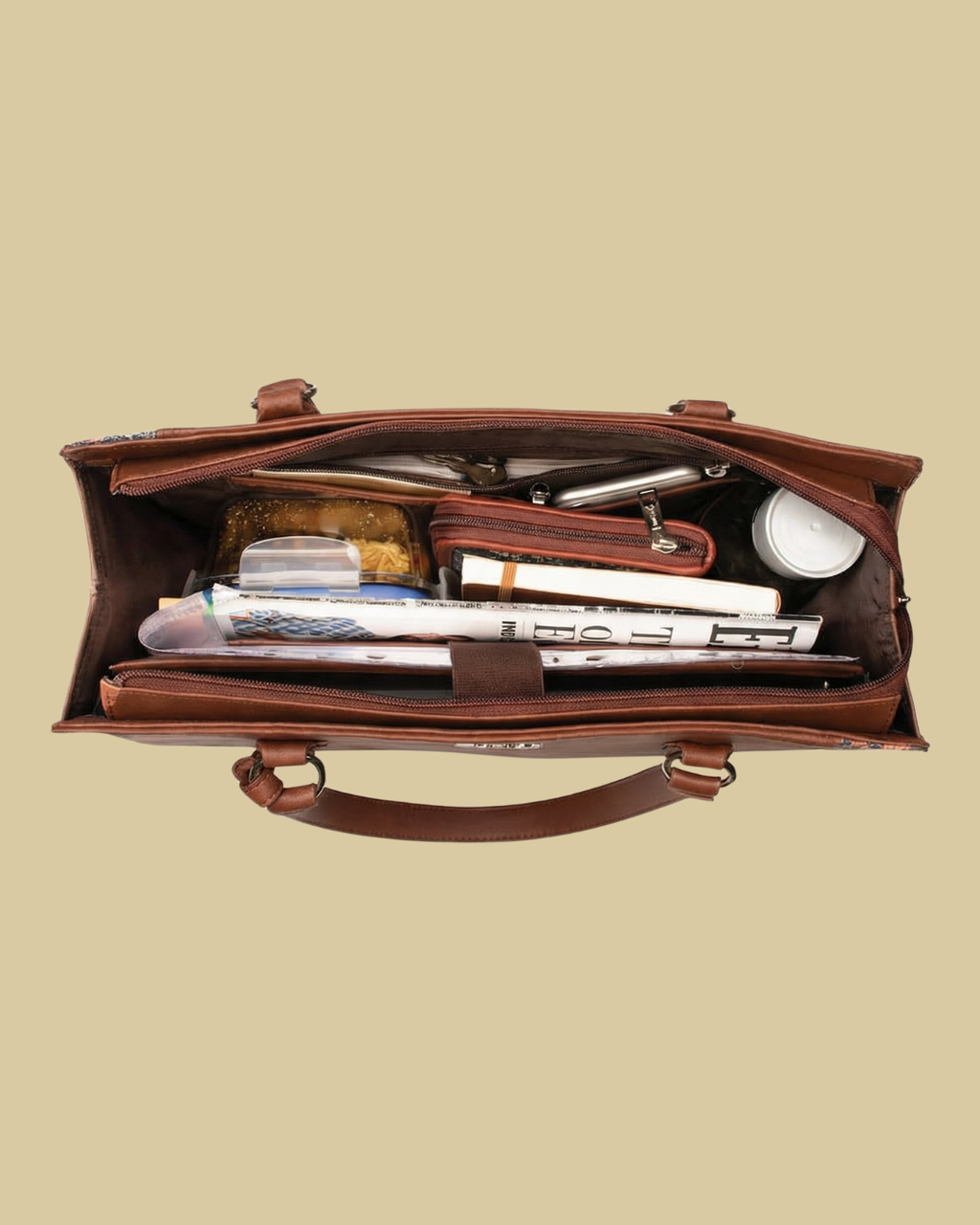 Open brown leather briefcase with office supplies on a beige background