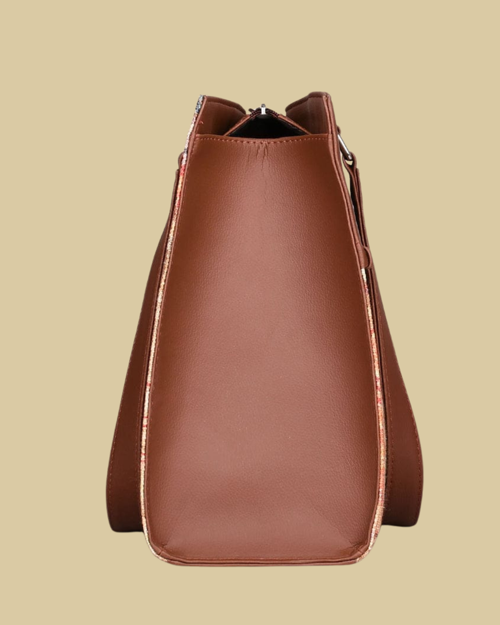 Brown leather handbag on a beige background