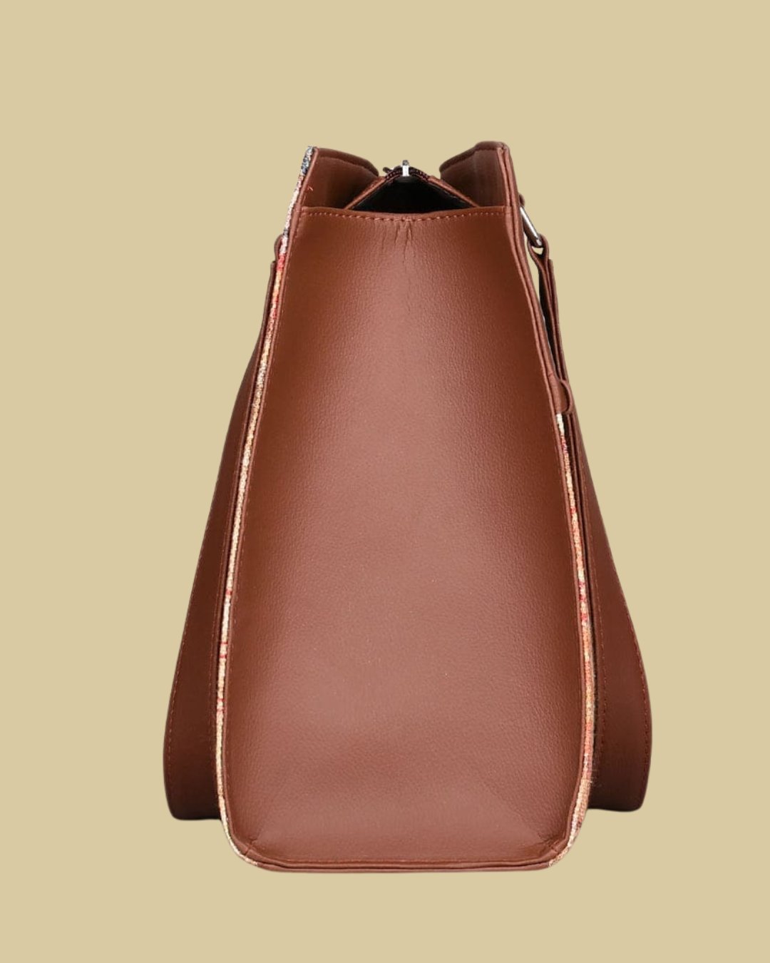 Brown leather handbag on a beige background