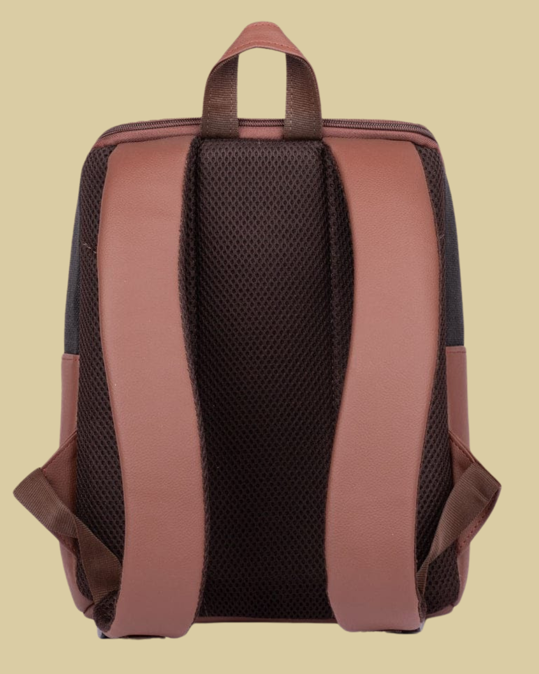 Backpack with brown straps on a beige background