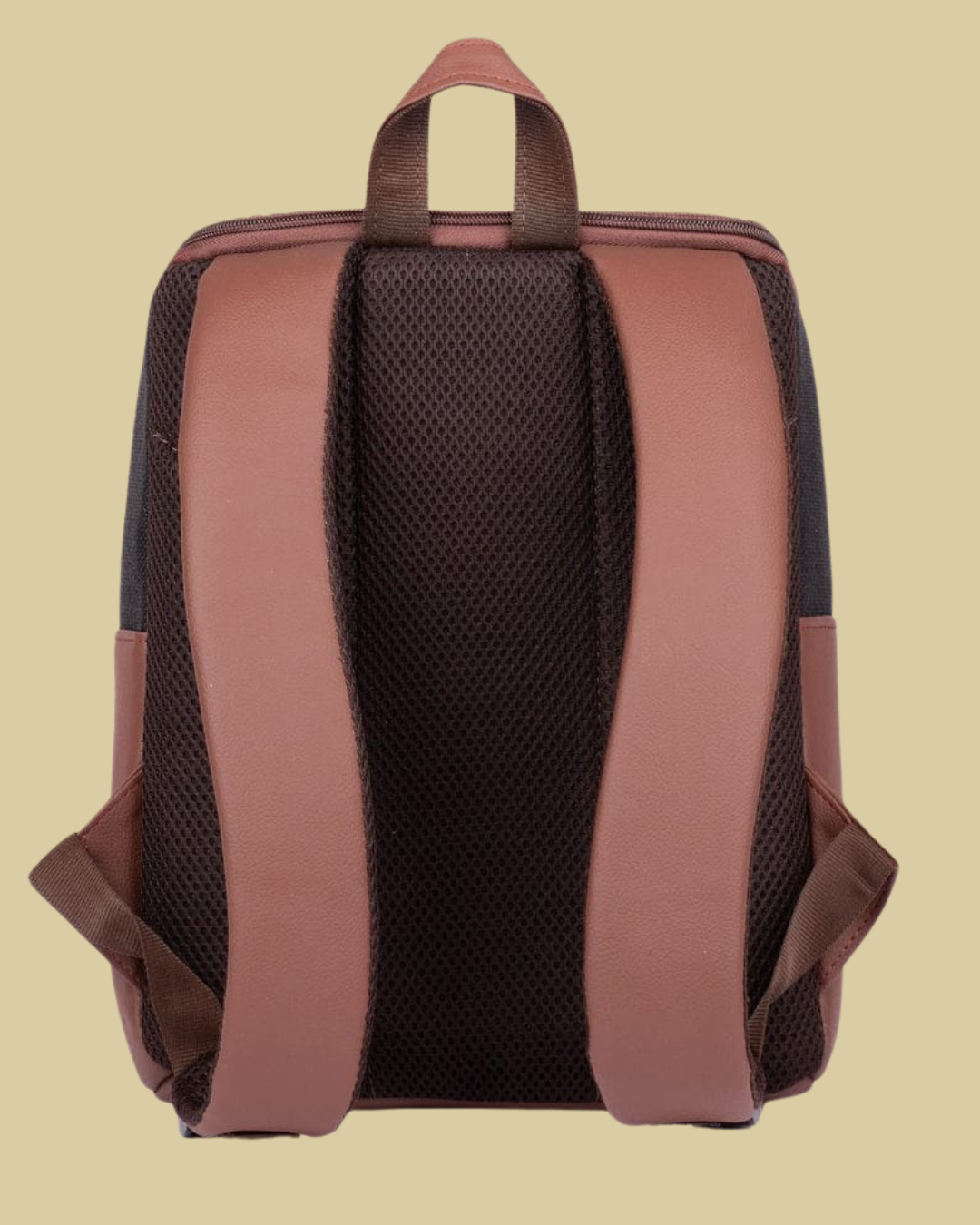 Backpack with brown straps on a beige background