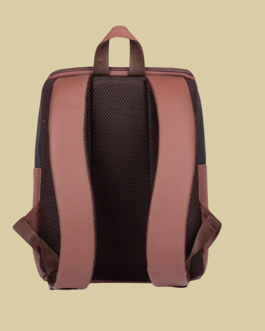 Backpack with brown straps on a beige background