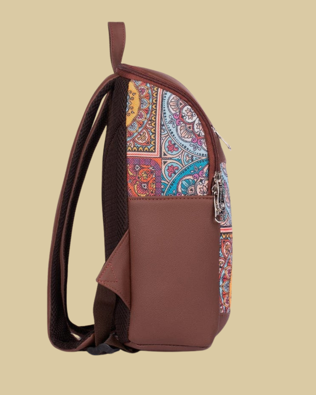 Brown backpack with colorful paisley pattern on a beige background