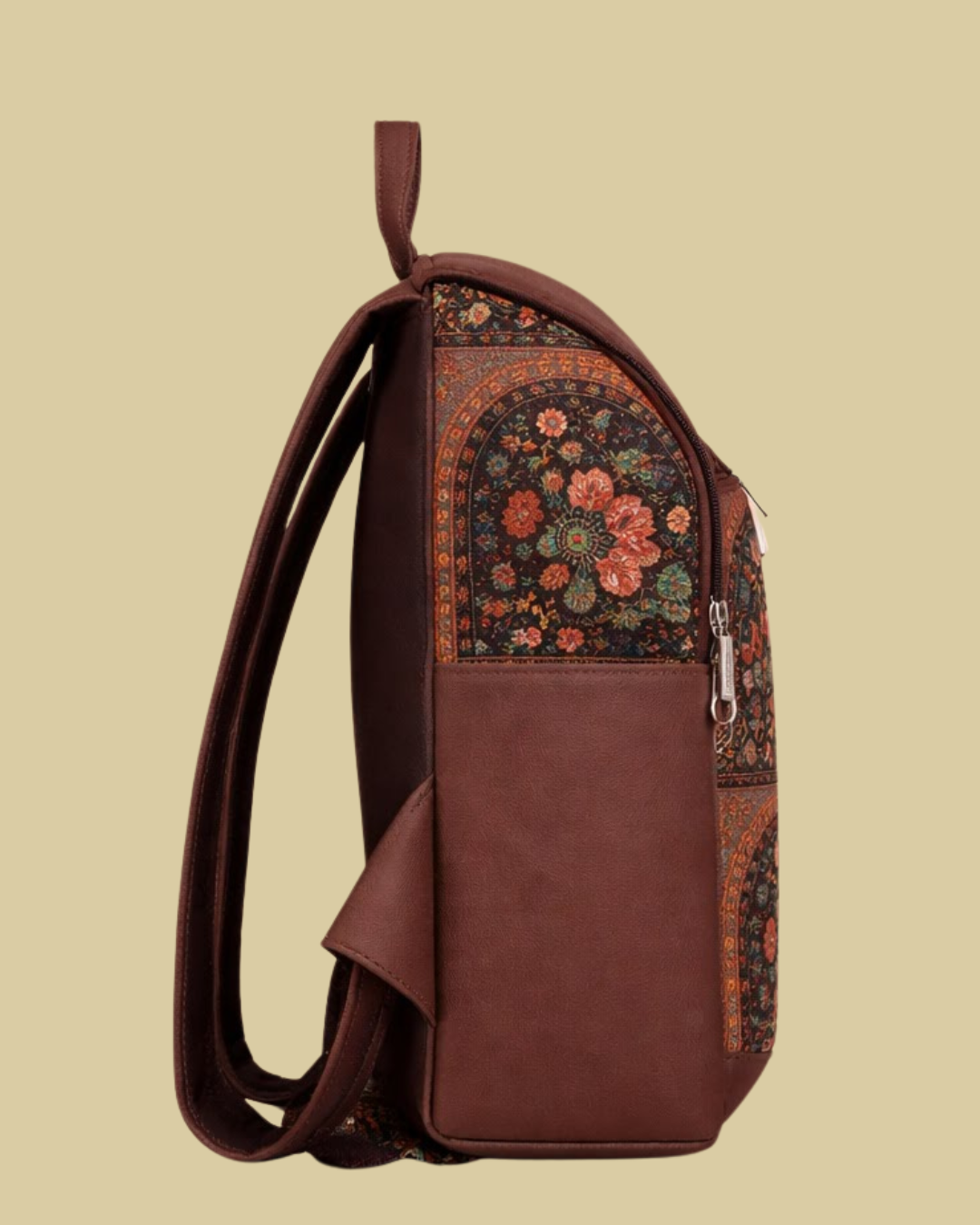Brown backpack with floral pattern on a beige background