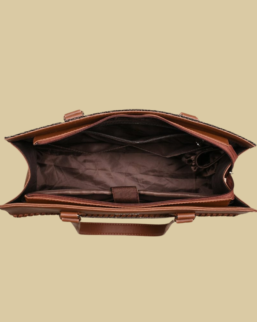 Brown leather bag on a beige background
