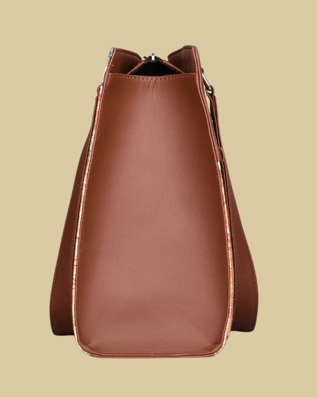 Brown leather handbag on a beige background