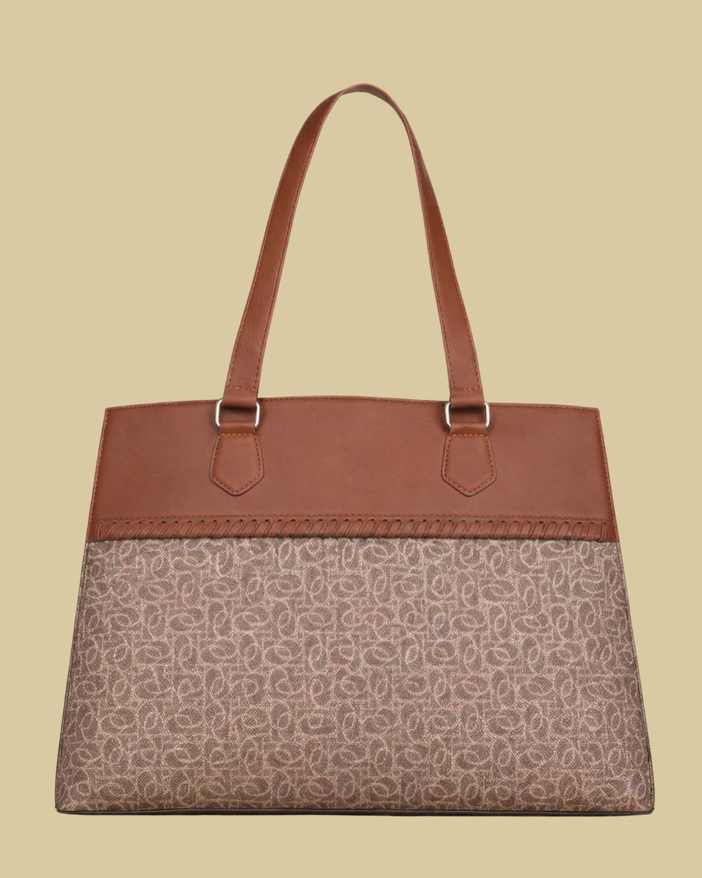 Handbag with brown top section and patterned bottom on a beige background
