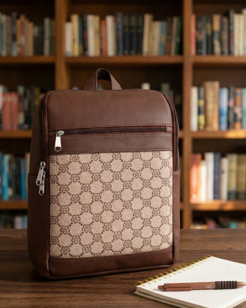 Brown and beige patterned backpack on a wooden surface with a bookshelf in the background